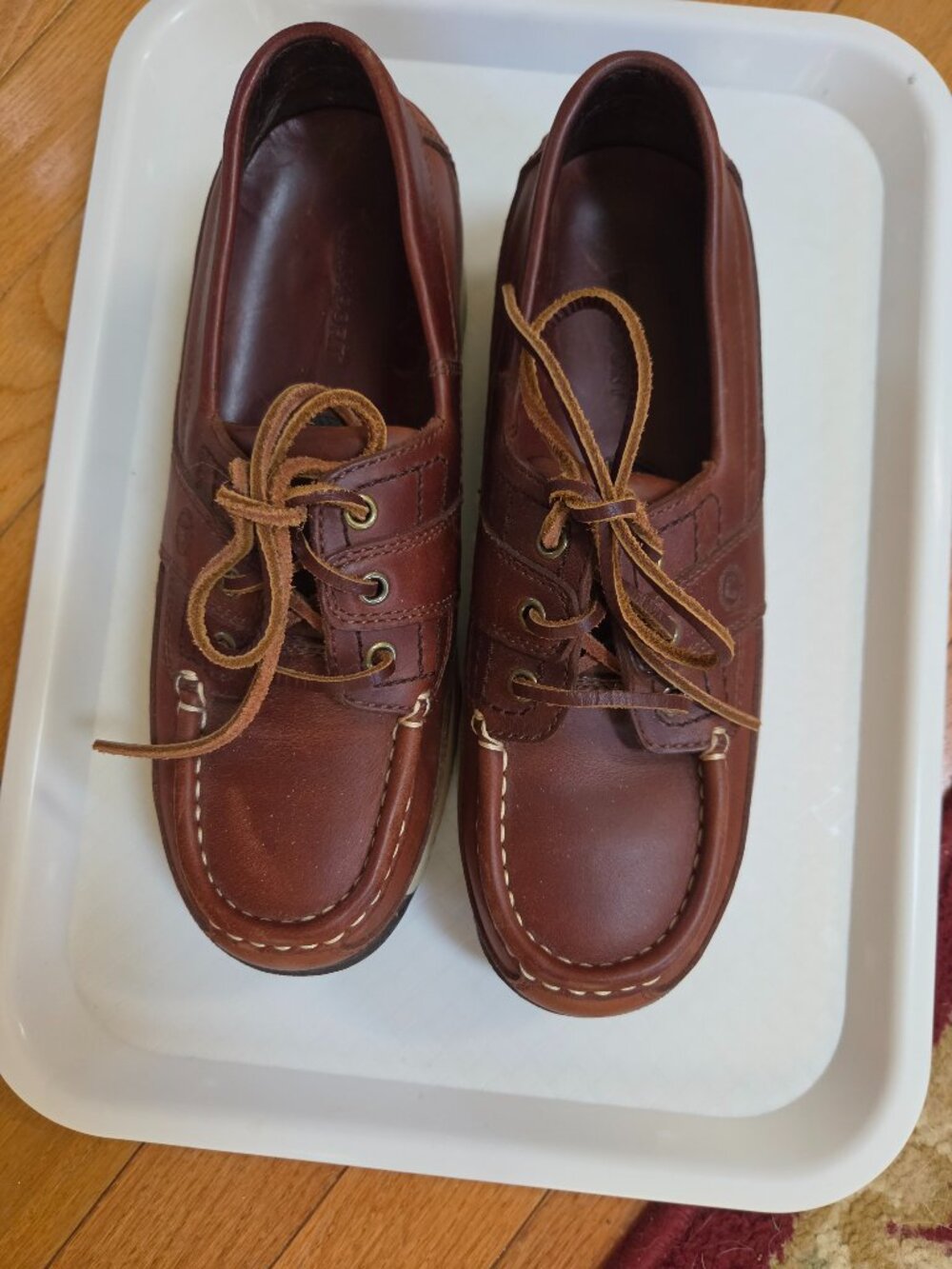 brown leather rockport womans boat shoes moc toe stitching and rawhide laces
